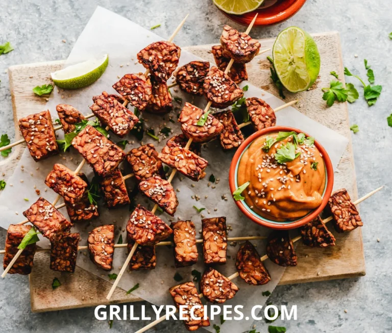Flat Top Grill sprinkled with sesame seeds, served with a creamy dipping sauce and fresh lime wedges.