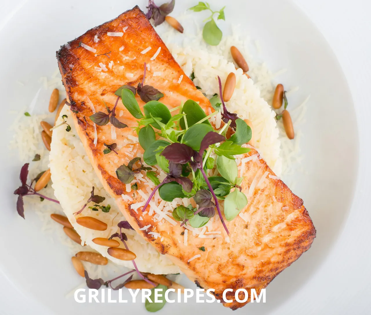 Grilled Dolphin Fish served on a bed of rice, garnished with fresh greens, parmesan cheese, and toasted pine nuts.