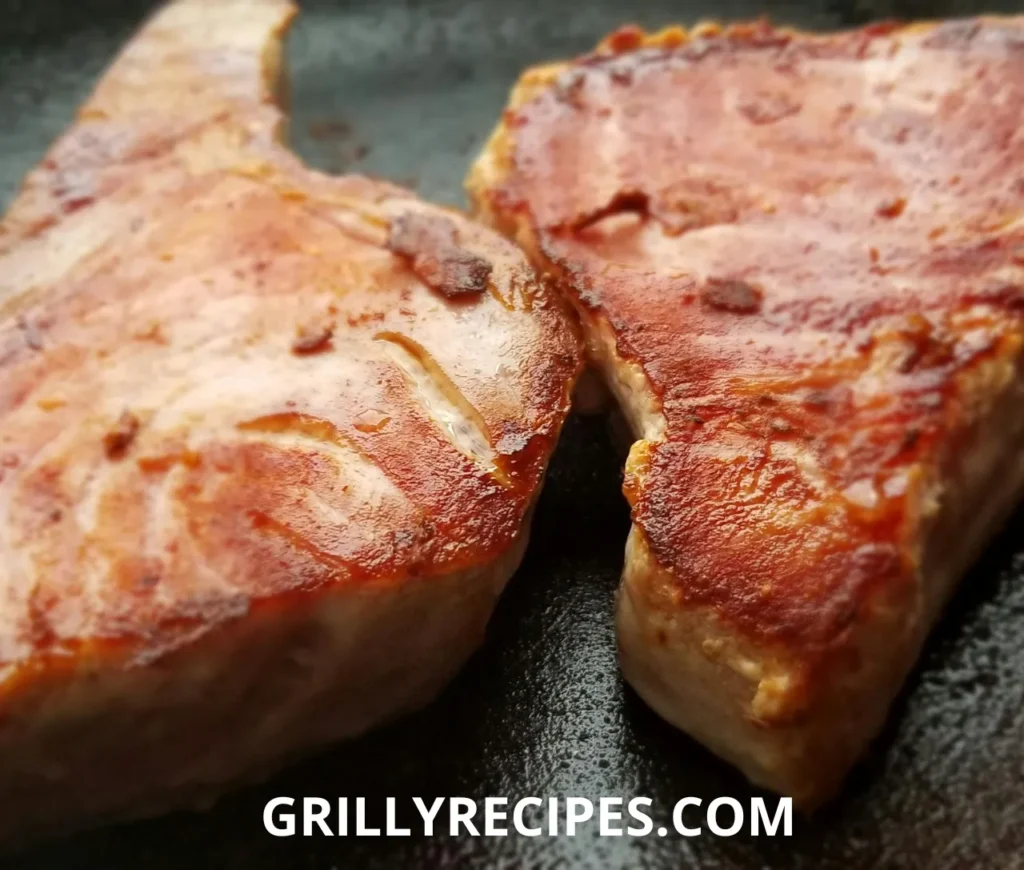 Perfectly grilled fish fillets with fresh herbs and lemon slices on a grill. How to Grill Fish