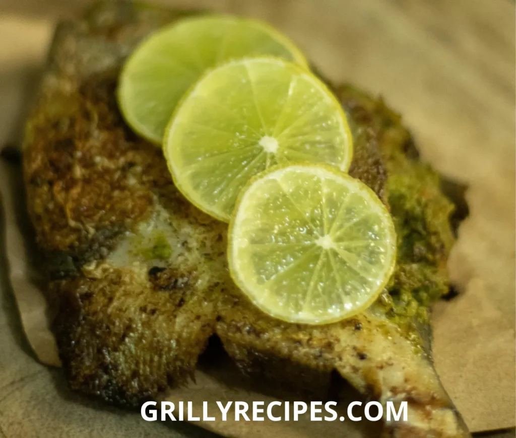 A perfectly grilled whole fish with crispy golden skin, garnished with fresh herbs and lemon slices, served on a wooden platter.