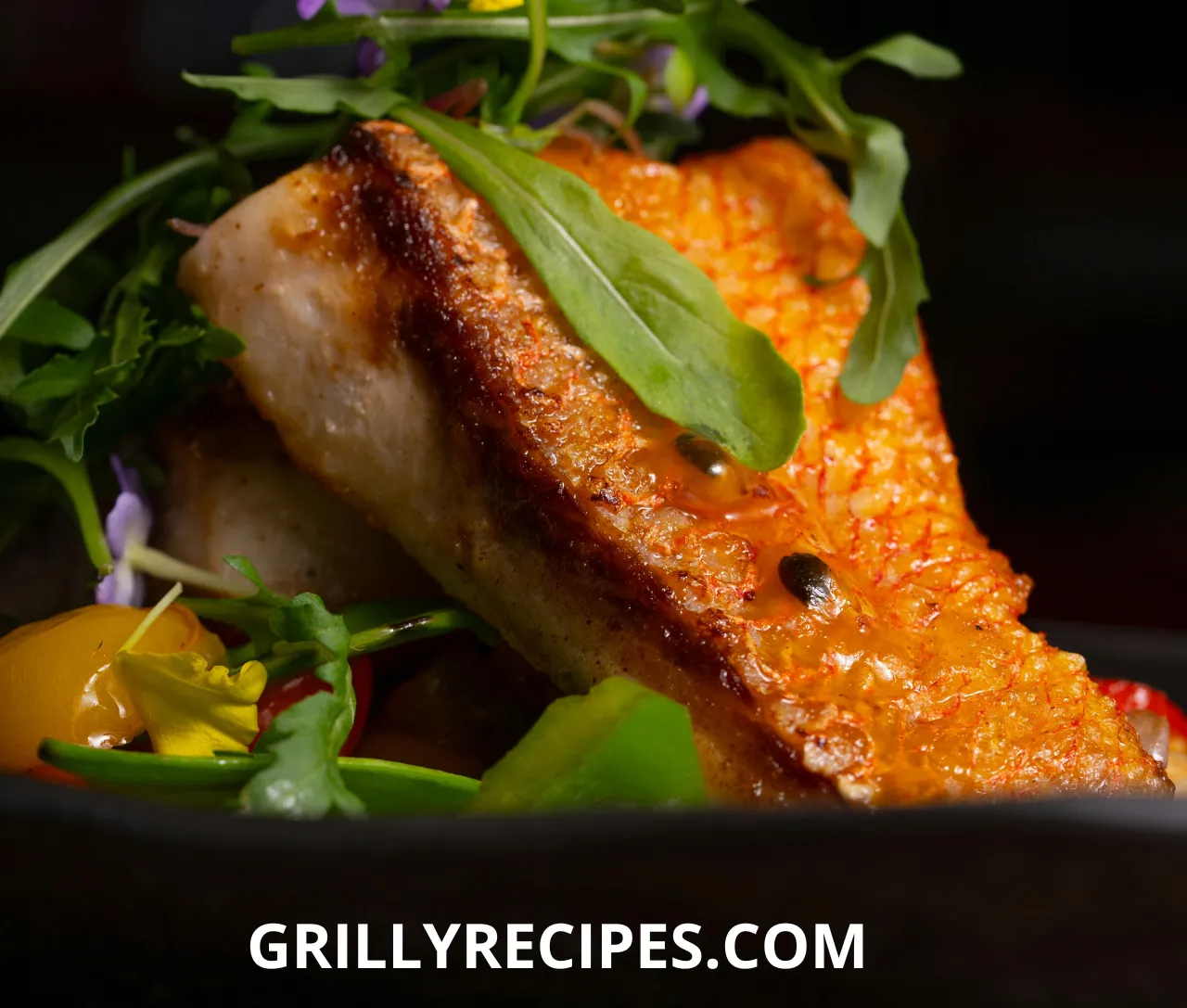 Freshly grilled branzino fillet garnished with lemon slices and herbs.