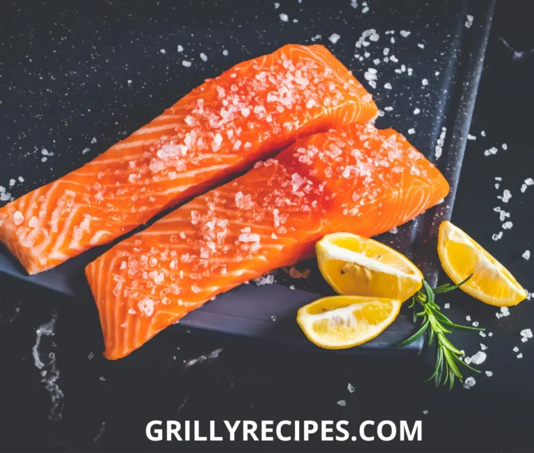 Fresh lemon slices placed on a perfectly cooked fish fillet, enhancing its flavor with a zesty touch.