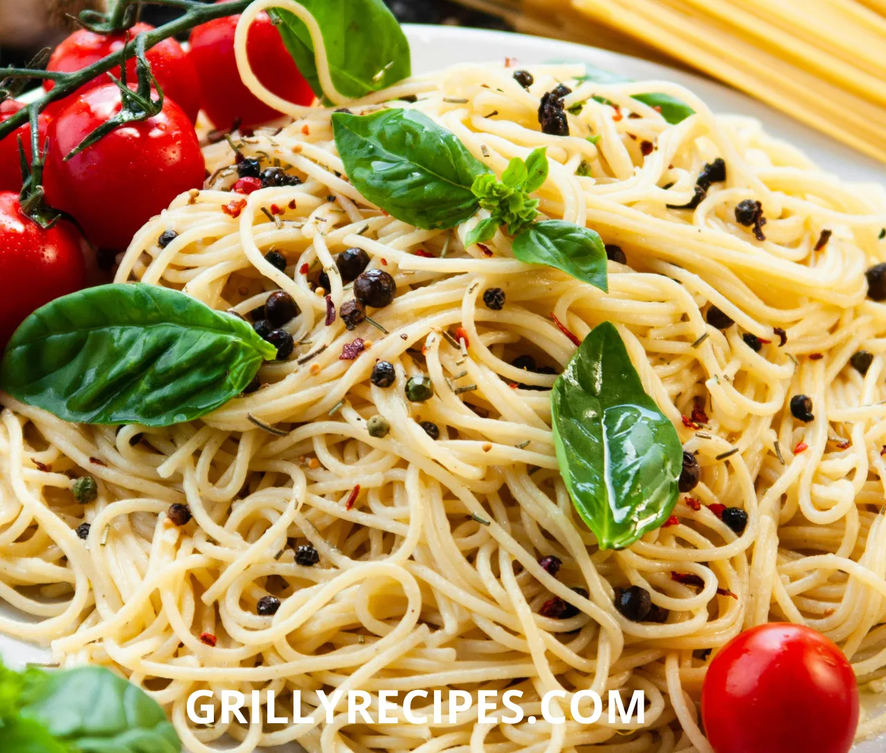Close-up of a baked chicken spaghetti casserole with golden melted cheddar cheese and fresh parsley garnish in a white dish