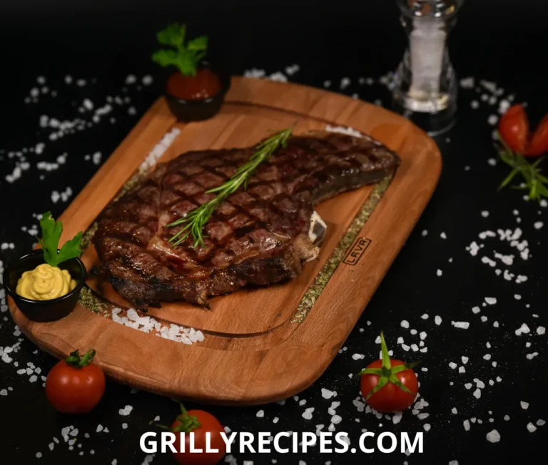 Colorful flank steak stir fry with onions and peppers on a white plate with sesame seeds