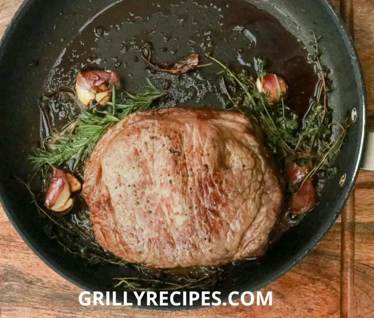A vibrant plate of beef stir fry meat featuring thinly sliced flank steak, colorful red bell peppers, broccoli florets, and onions in a glossy soy-based sauce, served over steamed rice with a sprinkle of sesame seeds.