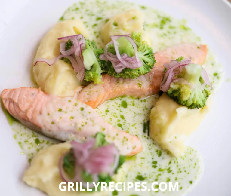 Chilled gefilte fish patties made with whitefish and carp, topped with carrot slices and fresh parsley, served with horseradish on a white plate, showcasing a traditional gefilte fish recipe.