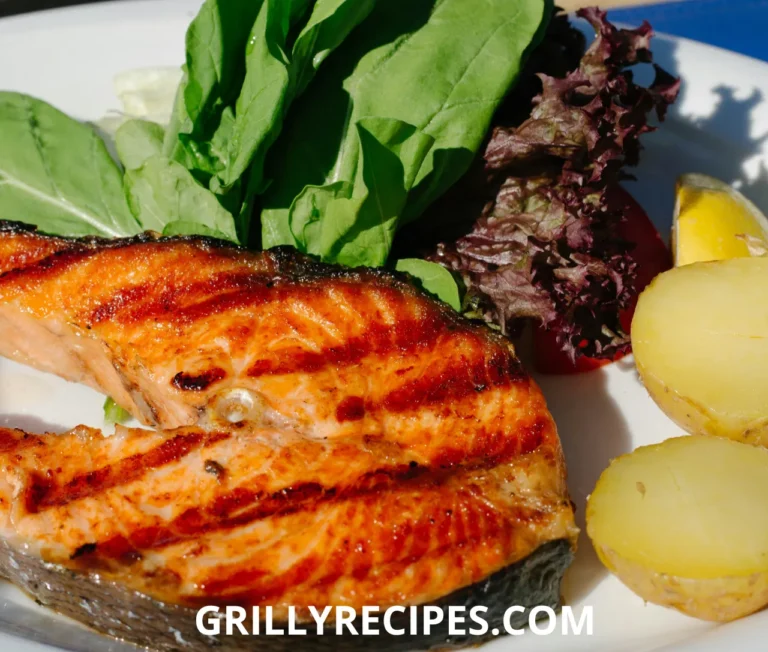 Golden crispy cod fillets seasoned with garlic and paprika, garnished with fresh thyme and lemon wedges on a white plate, showcasing a delicious fish food recipe.