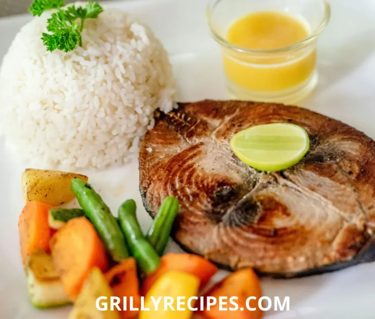 Golden fried cod fish fillets coated in cornmeal, seasoned with paprika and garlic, garnished with fresh parsley and a lemon wedge on a rustic plate, highlighting a crispy fried cod fish recipe.