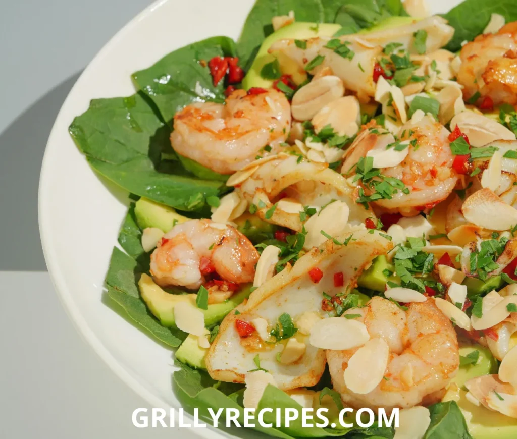 Succulent shrimp in a rich garlic butter sauce, garnished with fresh parsley and a lemon wedge on a white plate, showcasing a flavorful shrimp garlic butter recipe.
