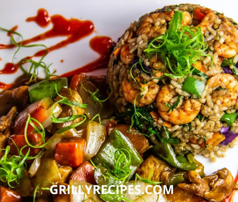 Succulent shrimp nestled in fluffy cajun-spiced rice with diced bell peppers, onions, and celery, garnished with fresh parsley in a black skillet, showcasing a vibrant cajun shrimp and rice recipe.