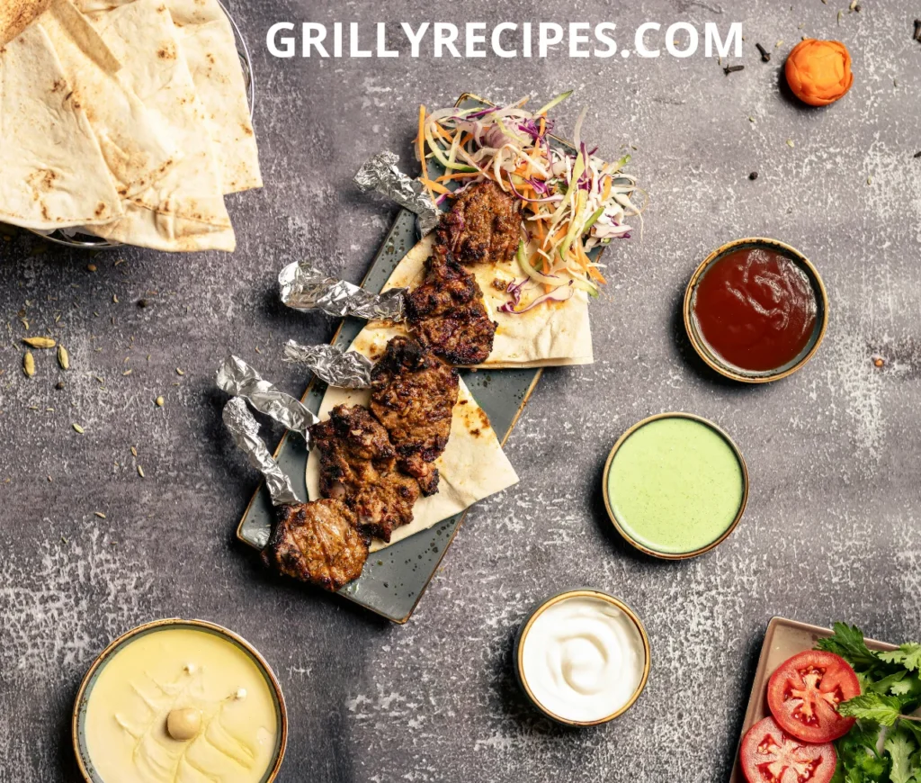 Grilled Beef Ribs skewers served on flatbread with coleslaw and a variety of dipping sauces.