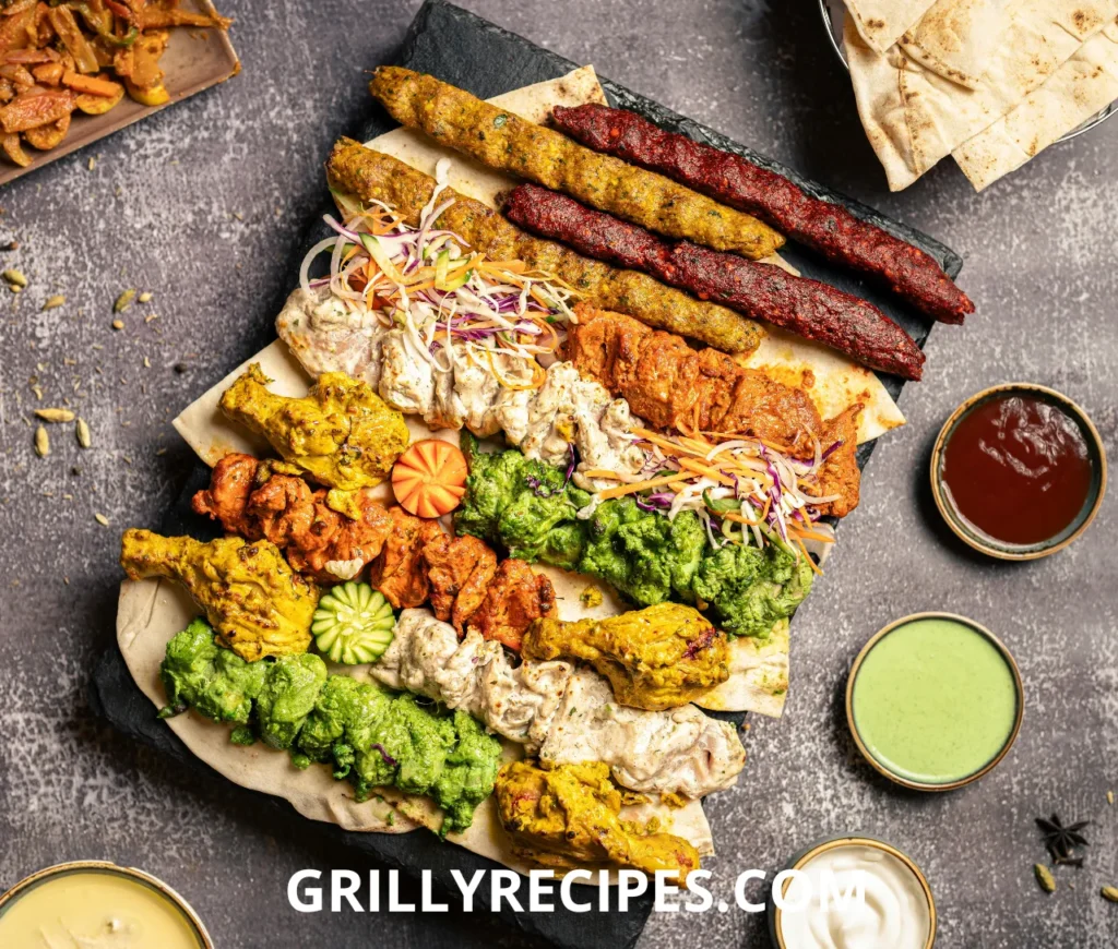 A variety of sizzling meats and vegetables cooking on a flat-top grill.