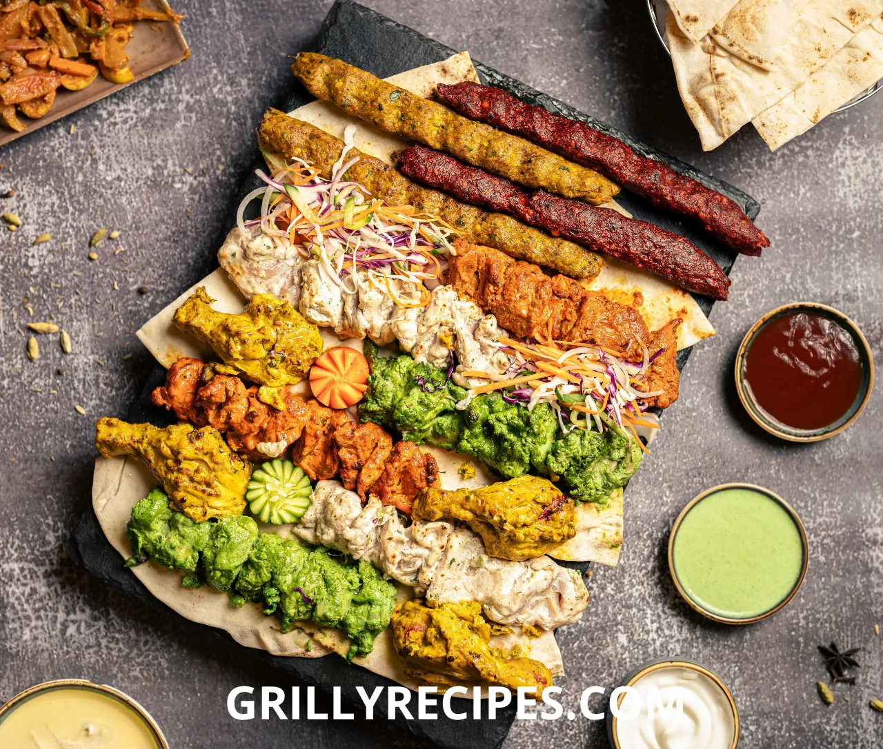 A variety of sizzling meats and vegetables cooking on a flat-top grill.