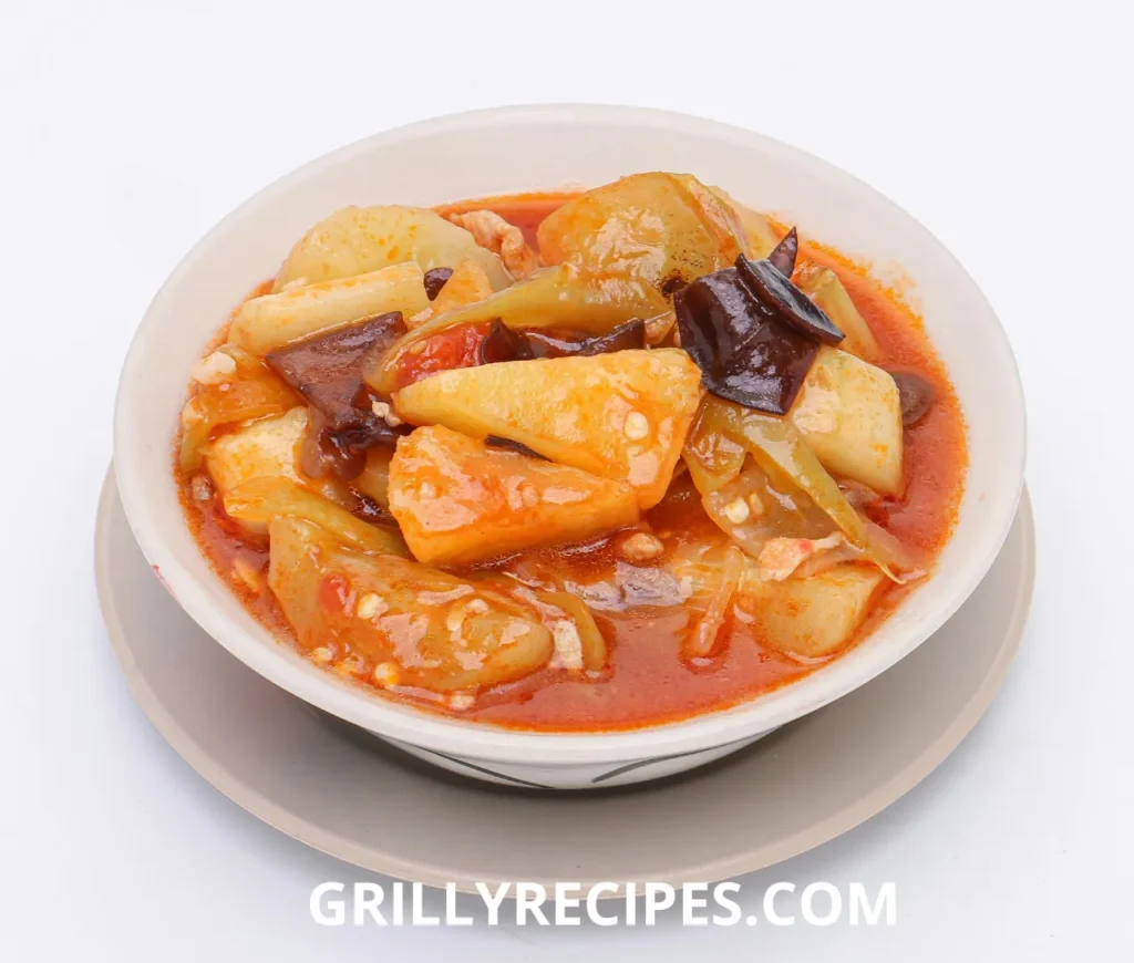 owl of spicy vegetable stew with potatoes, cabbage, and wood ear mushrooms in a rich red broth.